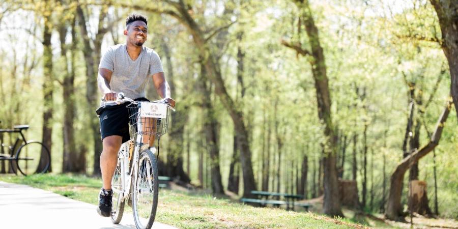 Local riding a Zagster bicycle on the Carrollton Greenbelt